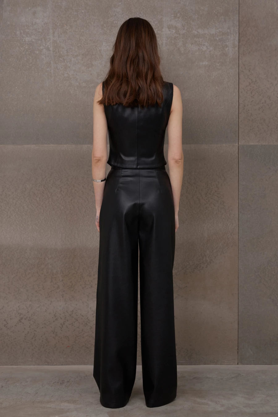 Black elongated palazzo pants made of eco-leather