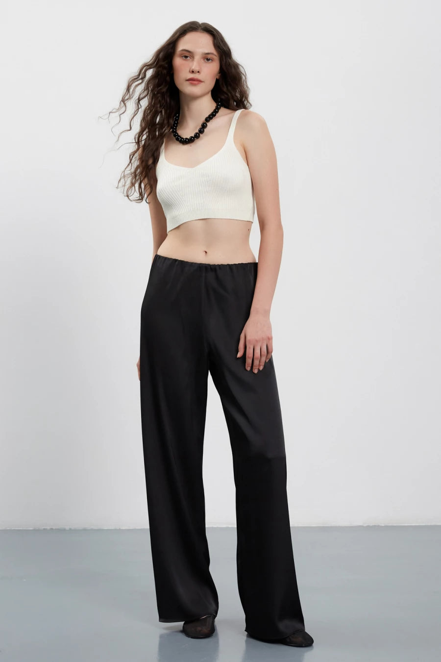 Straight-cut black satin pants