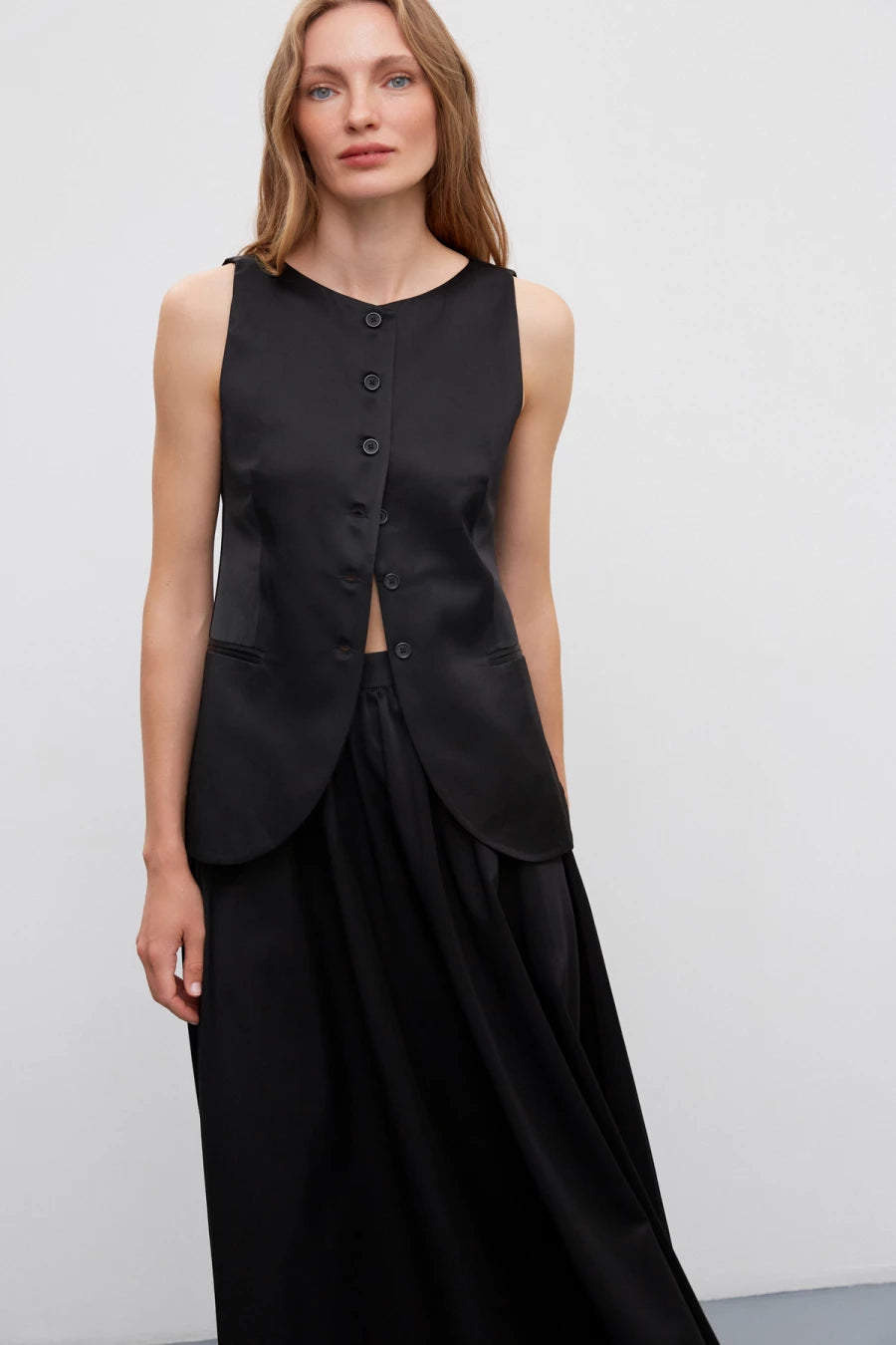 Black satin vest with a rounded bottom