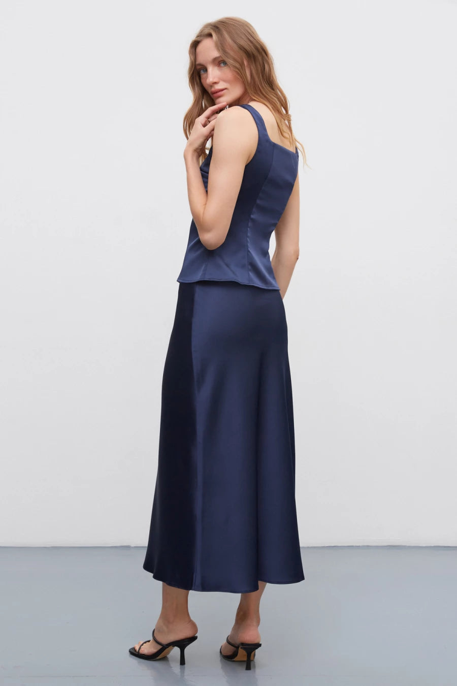 Dark blue long midi skirt made of dense satin