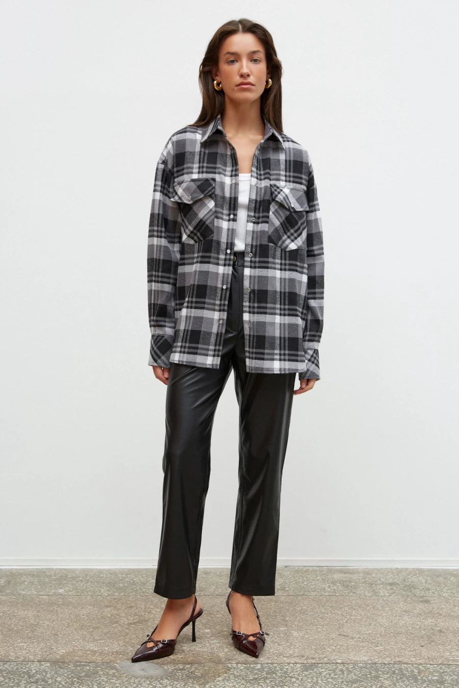 Black and white checked flannel shirt with a loose silhouette