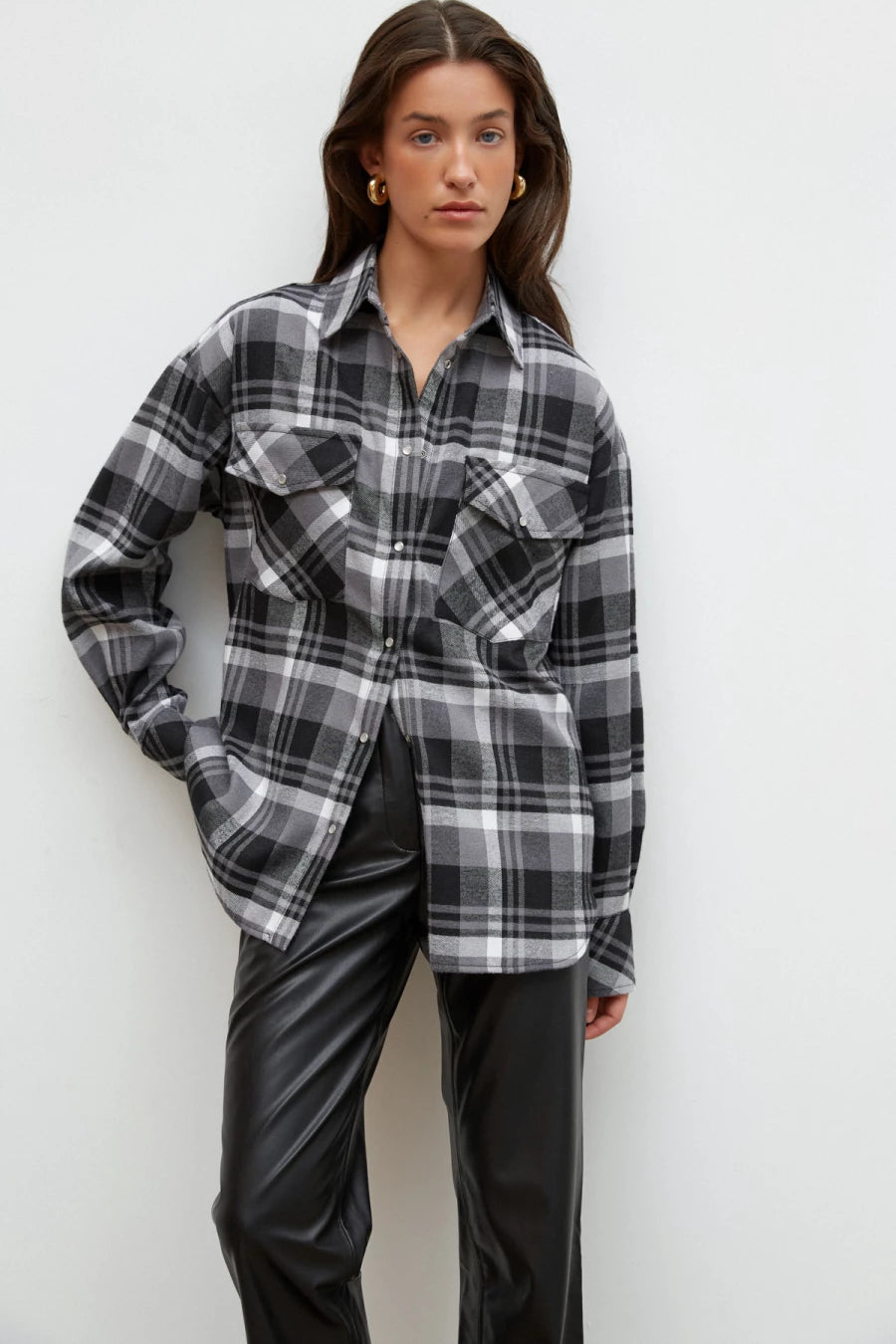 Black and white checked flannel shirt with a loose silhouette