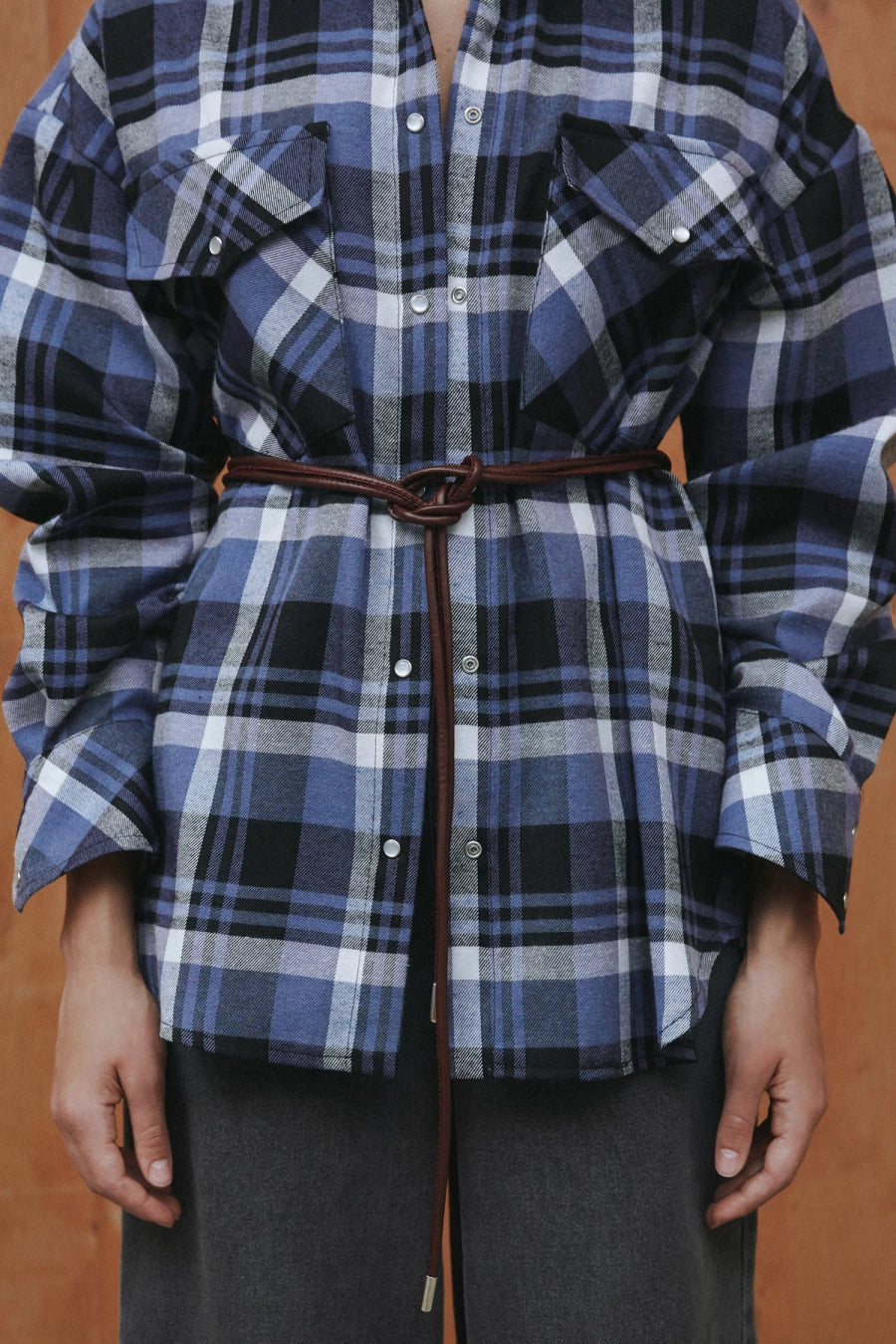 Black and blue checked flannel shirt with a loose silhouette