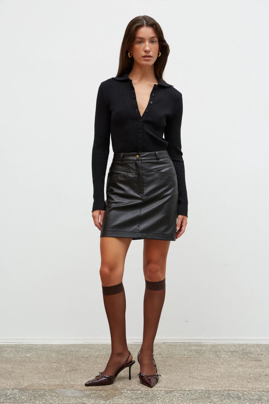 Black short trapeze skirt made of eco-leather