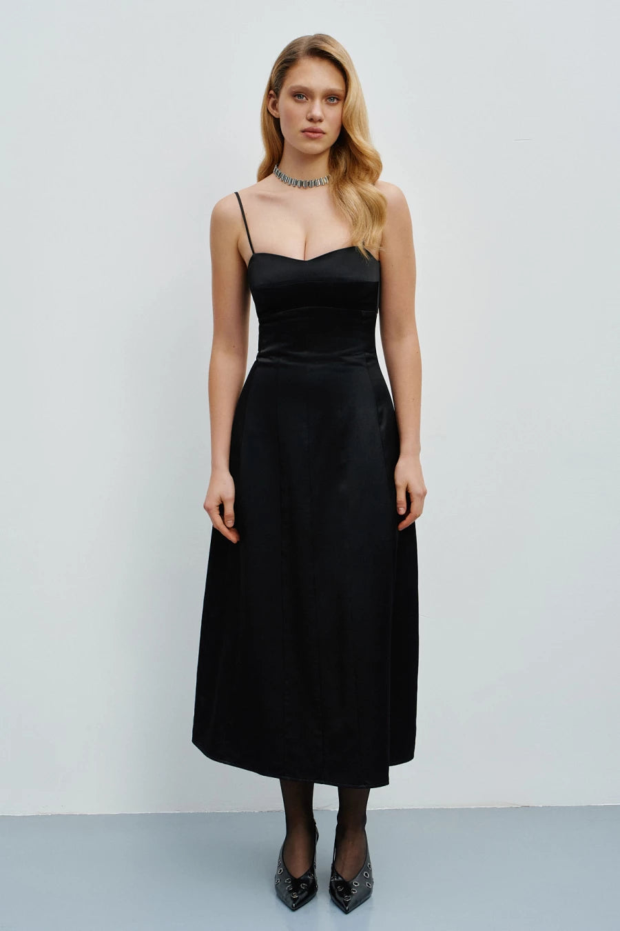 Black satin sundress with a figure-hugging neckline