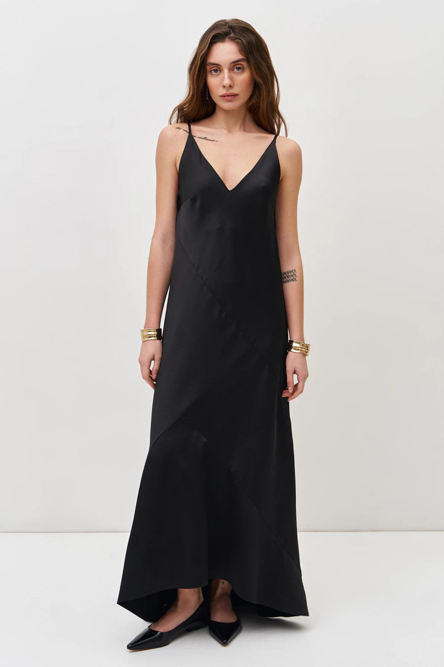 Black satin dress with asymmetrical seams