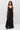Black satin dress with asymmetrical seams