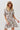 Short viscose dress in abstract brown print